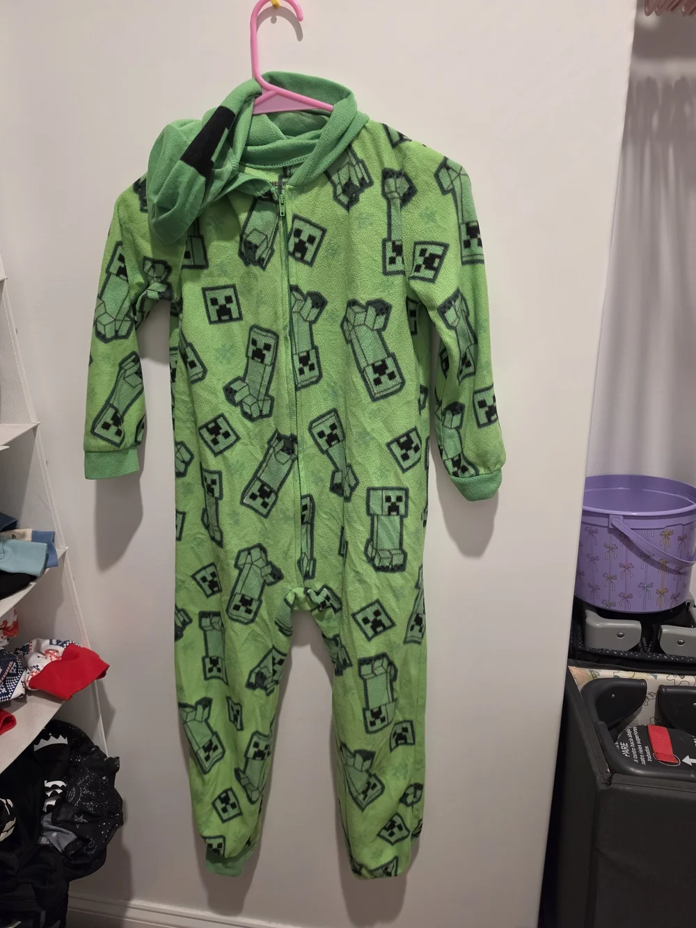 Green Minecraft Creeper onesie with black Creeper faces